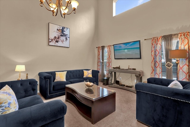 carpeted living room featuring a towering ceiling and a chandelier