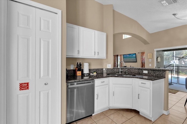 kitchen featuring white cabinetry, dishwasher, sink, dark stone counters, and a textured ceiling