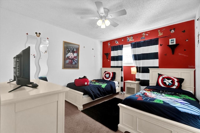 carpeted bedroom with ceiling fan and a textured ceiling