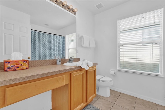 bathroom featuring vanity, tile patterned flooring, a shower with shower curtain, and toilet