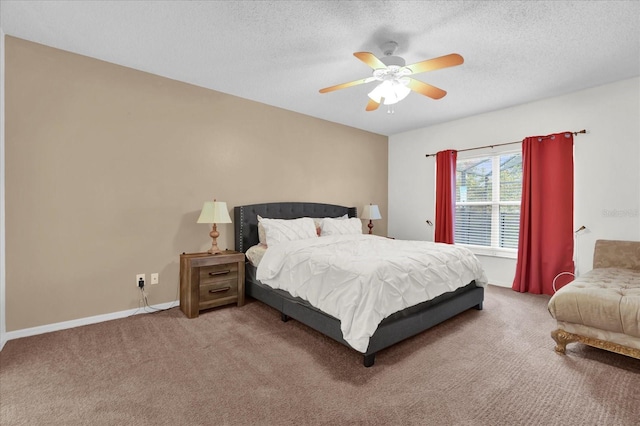 bedroom with carpet, ceiling fan, and a textured ceiling