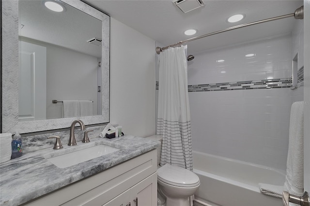 full bathroom featuring vanity, toilet, and shower / bath combo with shower curtain