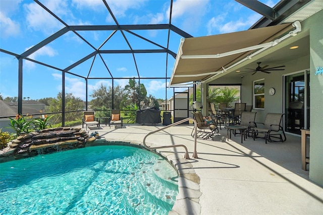 view of pool with a lanai and a patio area