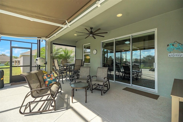 view of patio / terrace featuring ceiling fan