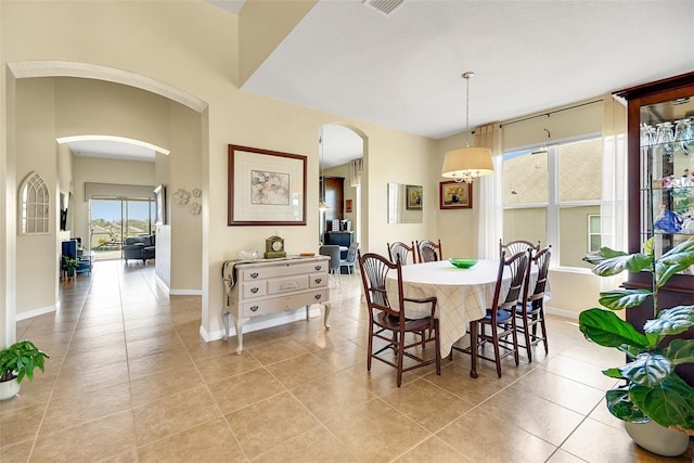 dining space with light tile patterned floors