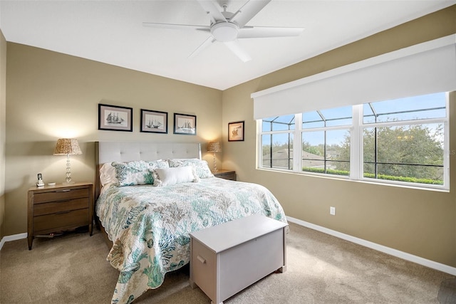 bedroom featuring ceiling fan and light carpet