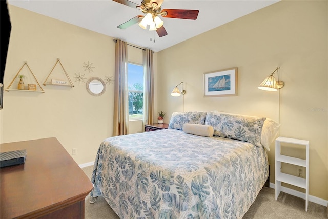 bedroom featuring light colored carpet and ceiling fan