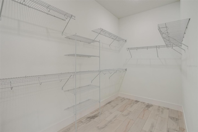 spacious closet with light wood-type flooring