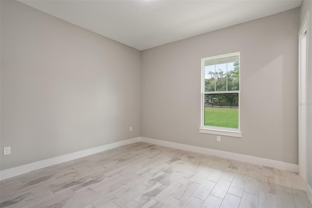 empty room with light hardwood / wood-style floors