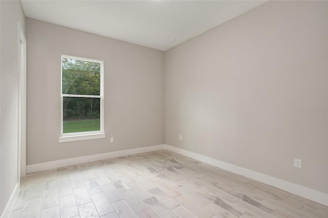 spare room featuring light hardwood / wood-style floors