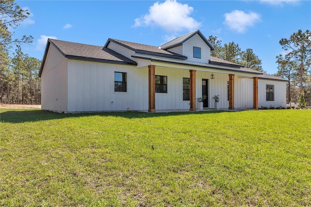 modern farmhouse style home with a front lawn