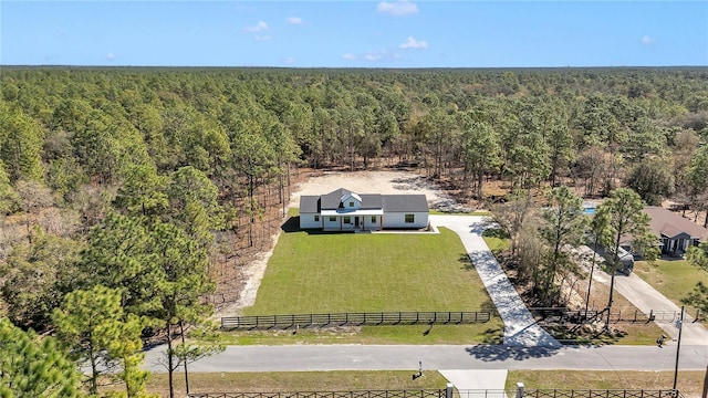 aerial view featuring a wooded view