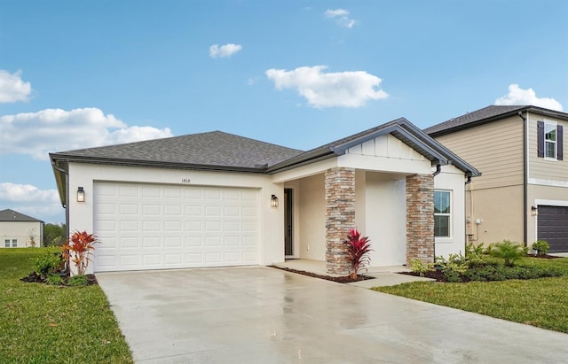 single story home featuring a front lawn and a garage