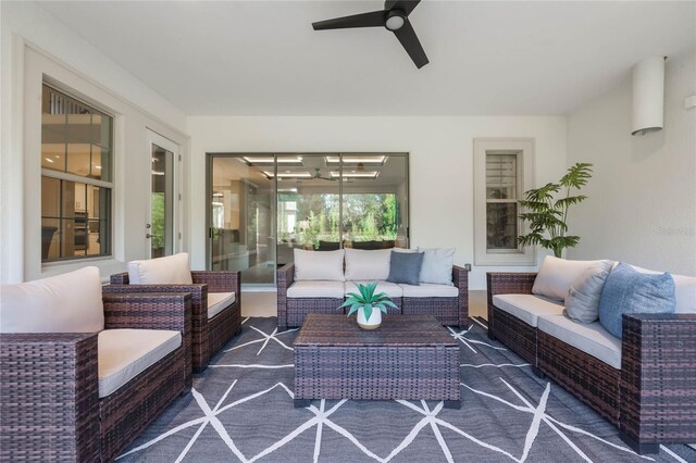 sunroom / solarium with ceiling fan