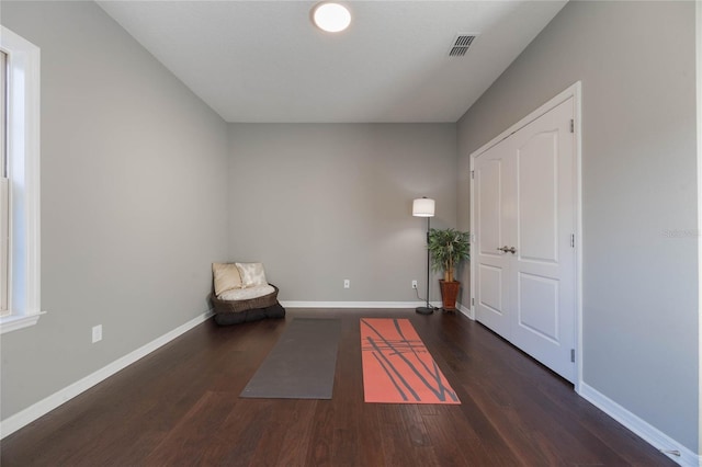 unfurnished room with dark hardwood / wood-style floors