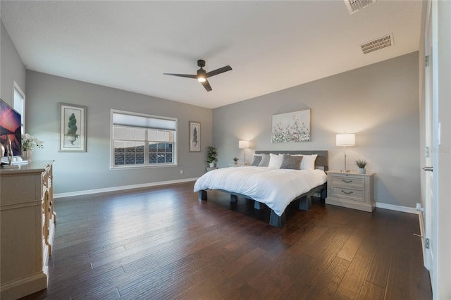 bedroom with ceiling fan and dark wood-type flooring