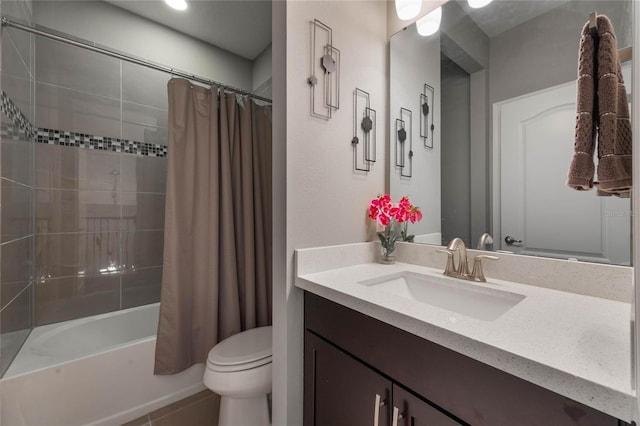 full bathroom featuring tile patterned floors, vanity, shower / tub combo, and toilet