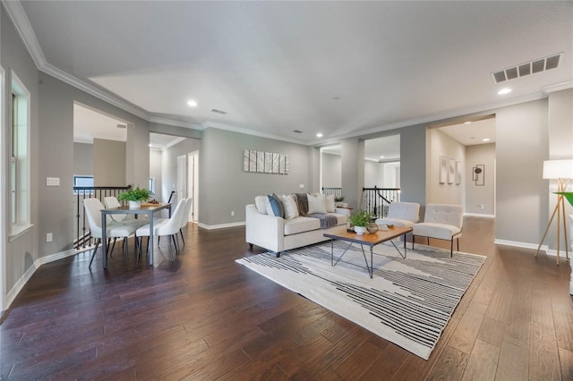 living room with dark hardwood / wood-style floors and ornamental molding