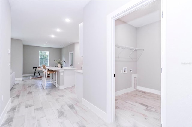 12220 SW 76th Ln, Dunnellon, FL 34432 - laundry area featuring hookup for a washing machine, hookup for an electric dryer, recessed lighting, and light wood finished floors