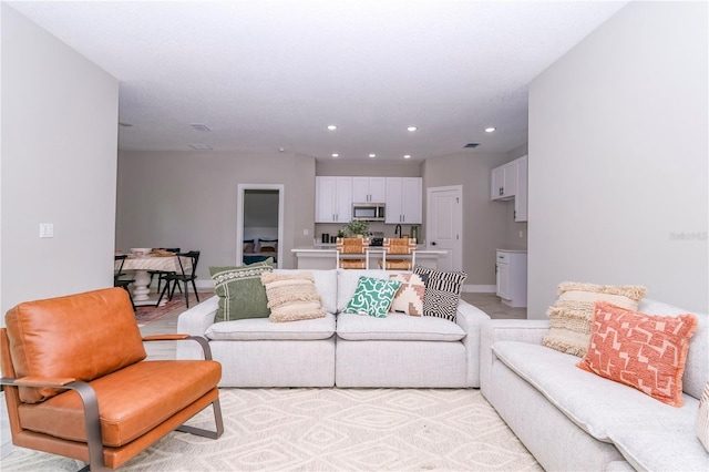 12220 SW 76th Ln, Dunnellon, FL 34432 - living room featuring recessed lighting and baseboards