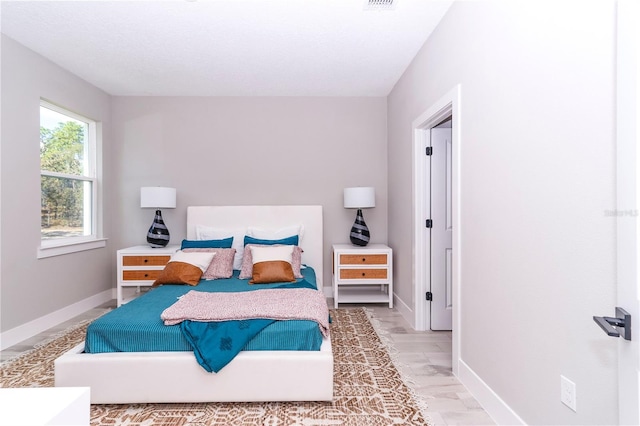 bedroom with hardwood / wood-style flooring