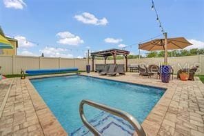 view of pool featuring a gazebo and a patio