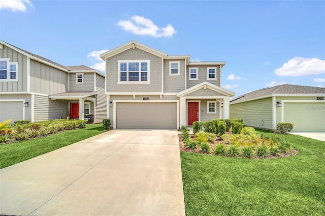 view of front facade with a front yard and a garage