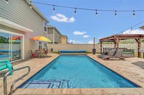 view of pool with a gazebo and a patio