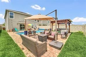 view of patio / terrace featuring a pergola, outdoor lounge area, and a fenced in pool