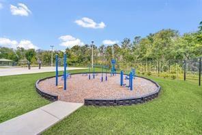 surrounding community with a yard and a playground