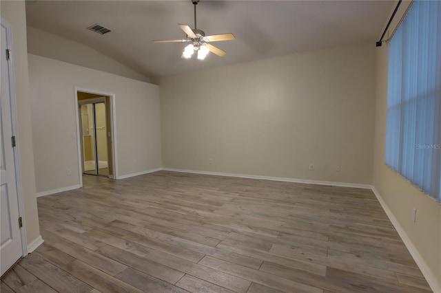 unfurnished room featuring vaulted ceiling, light hardwood / wood-style flooring, and ceiling fan