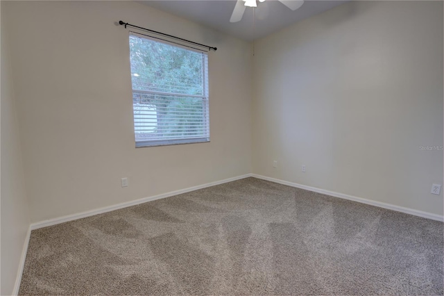 carpeted empty room featuring ceiling fan