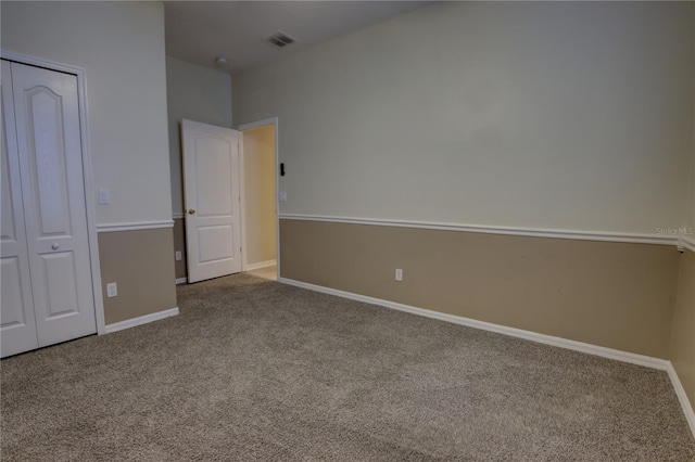 unfurnished bedroom featuring a closet and carpet