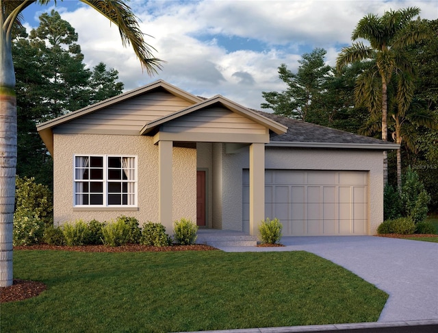 view of front of home featuring a front yard and a garage