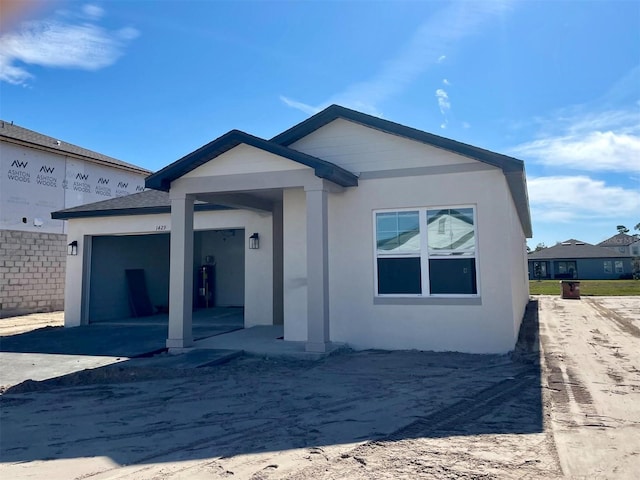 back of house featuring a garage