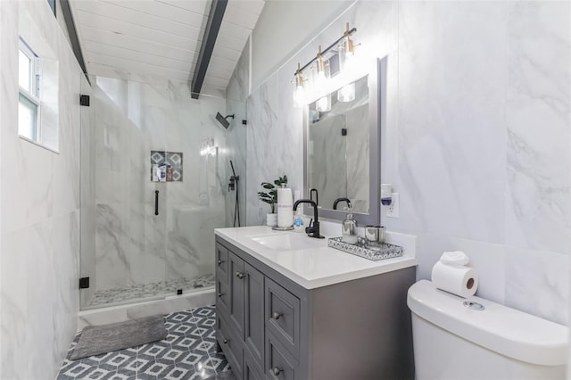 bathroom featuring vanity, vaulted ceiling with beams, toilet, and an enclosed shower