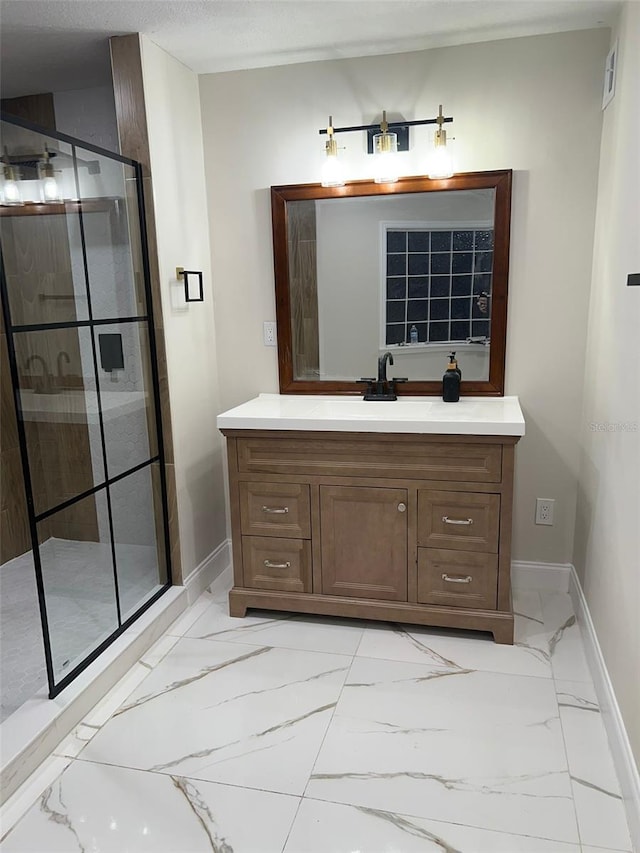 bathroom with walk in shower and vanity