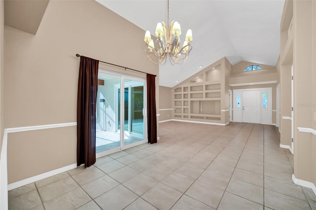 interior space featuring built in shelves, light tile patterned flooring, high vaulted ceiling, and an inviting chandelier