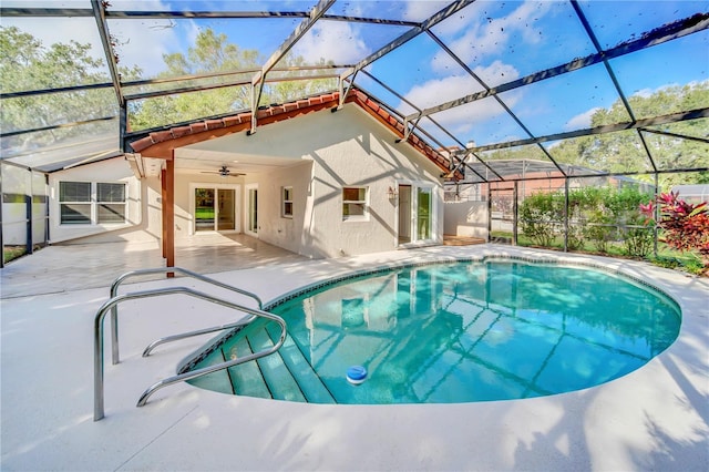 view of pool featuring a lanai, ceiling fan, and a patio