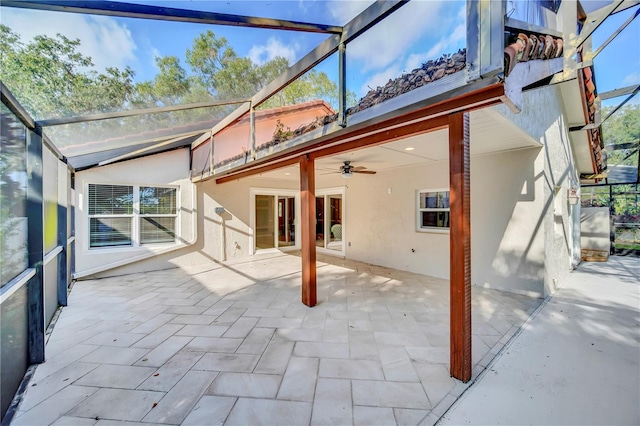 exterior space with ceiling fan