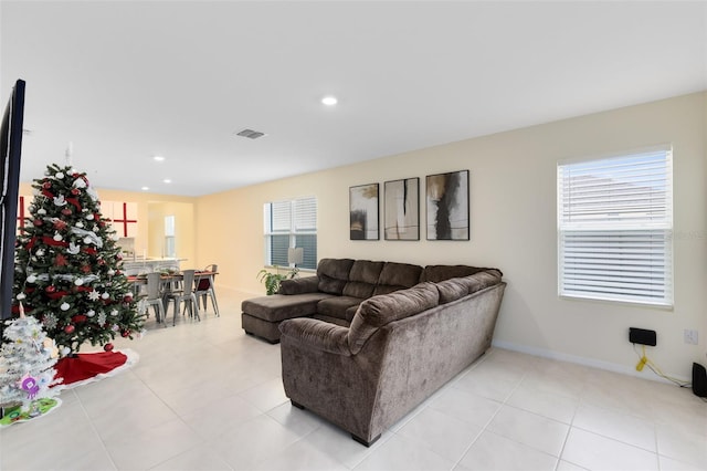 tiled living room featuring a wealth of natural light