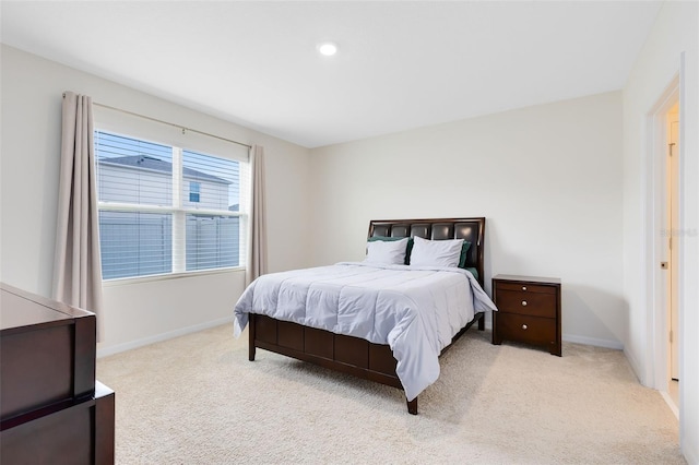 bedroom with light colored carpet