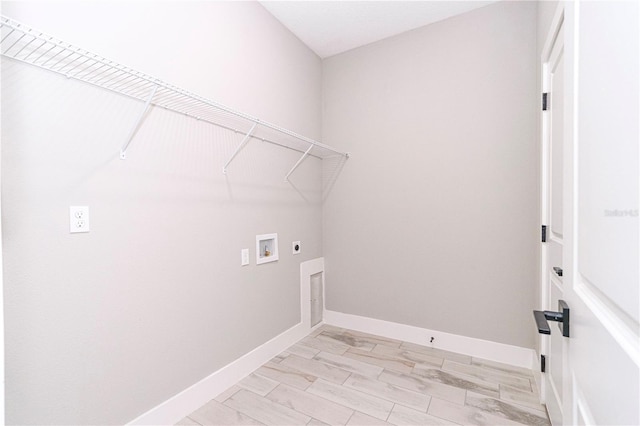 laundry area featuring washer hookup, electric dryer hookup, and light hardwood / wood-style flooring