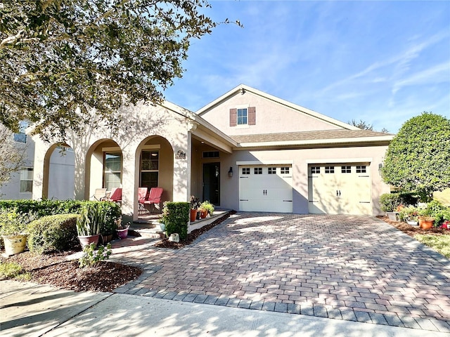 view of front facade with a porch and a garage