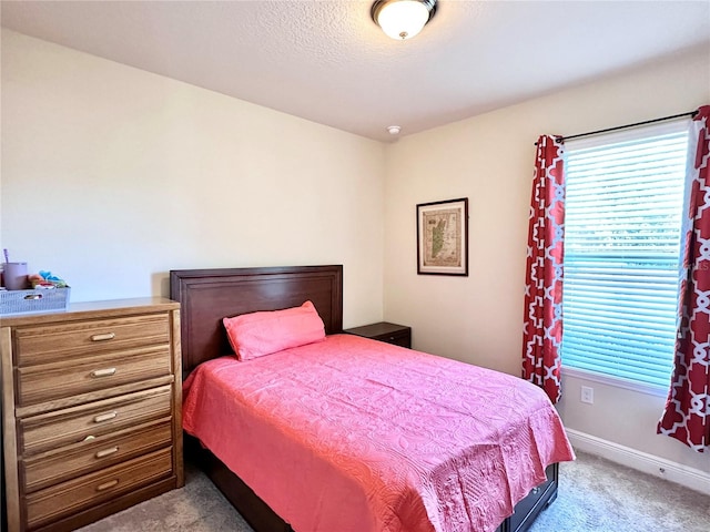 bedroom featuring light colored carpet