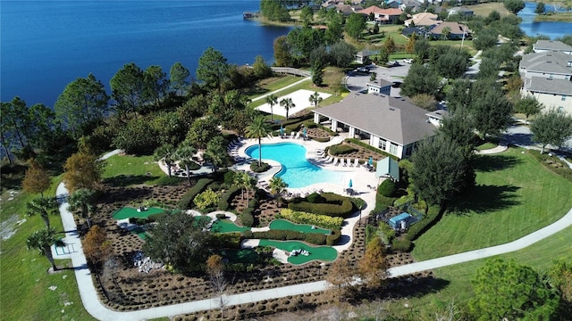 birds eye view of property with a water view