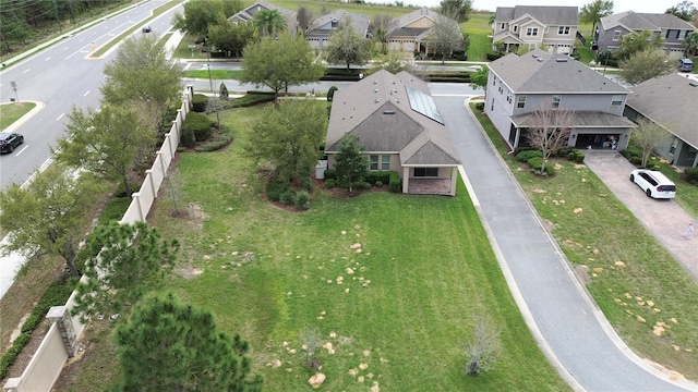 birds eye view of property with a residential view