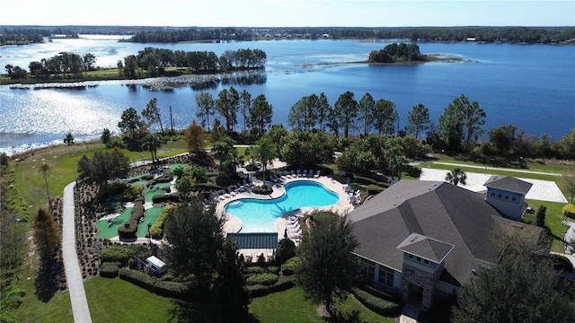 birds eye view of property with a water view