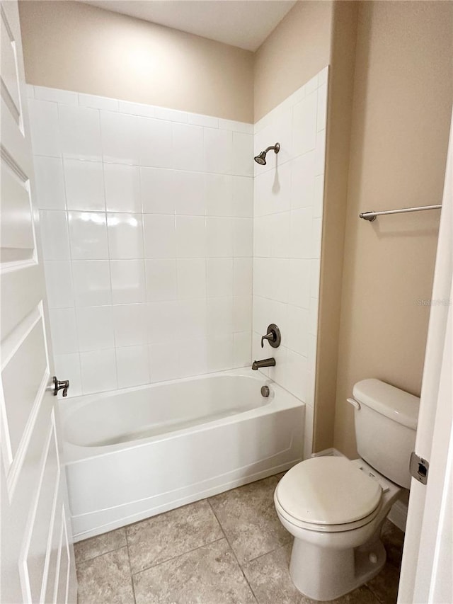 bathroom with toilet and shower / washtub combination