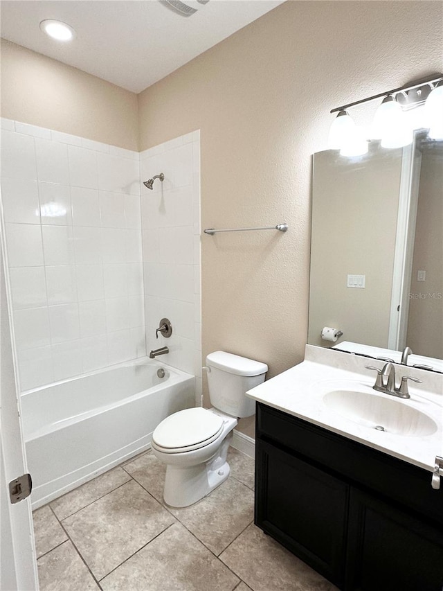 full bathroom with vanity, tile patterned floors, toilet, and shower / washtub combination